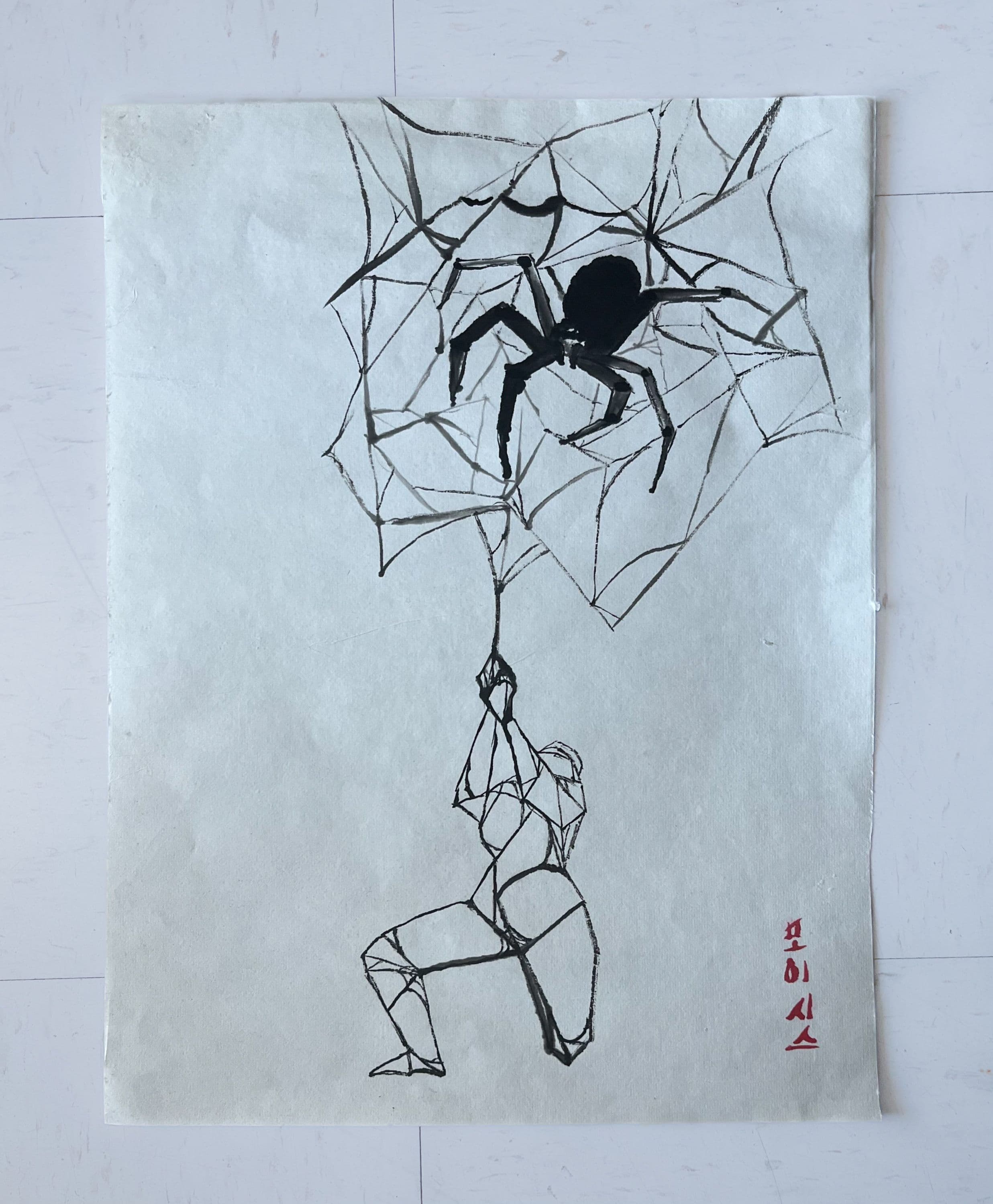 Spider in a web with person made of webs hanging underneath